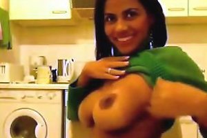 Attractive Indian Woman Displays Her Large Breasts And Grins